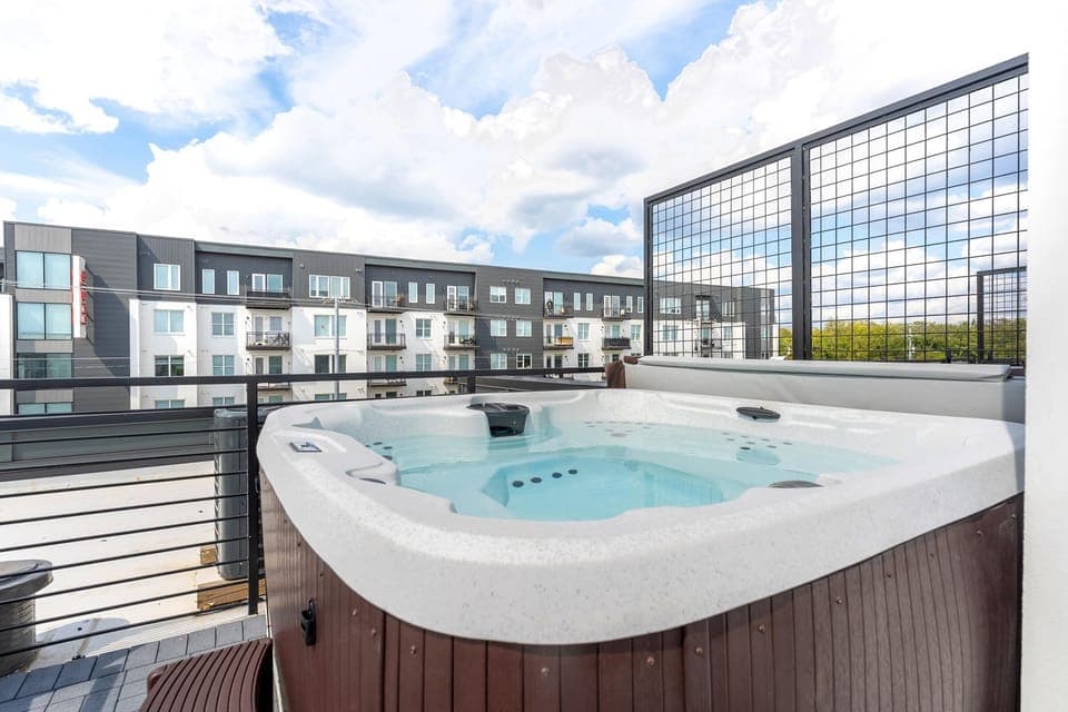 Relax in this Nashville Luxury Vacation Home with a private rooftop hot tub. Soak in the skyline - ideal for family reunions or bachelorette getaways. Book with Misfit Homes today!