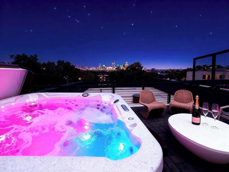 Unwind in style on your luxurious rooftop deck with a hot tub and breathtaking Downtown Nashville skyline views—perfect for bachelorette parties or chic group getaways in Music City.