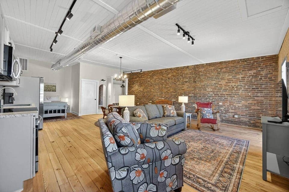 Relax in this cozy living room and watch your favorite show. Enjoy the view as you rock by the window. The 4K Smart TV has all your favorite streaming services pre-downloaded. Bring your own login.