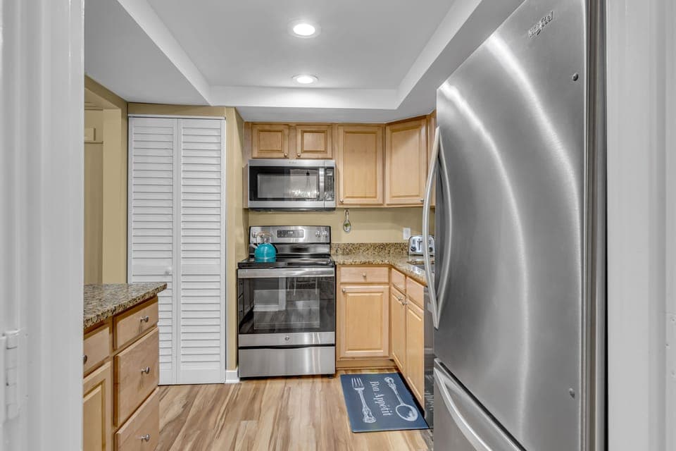 Your fully equipped kitchen invites culinary adventures with granite counters, stainless appliances, and everything needed for memorable meals.