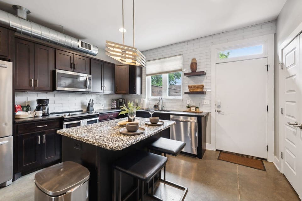 Kitchen: Whip up meals with ease—spacious counters and a central island made for cooking and conversation."