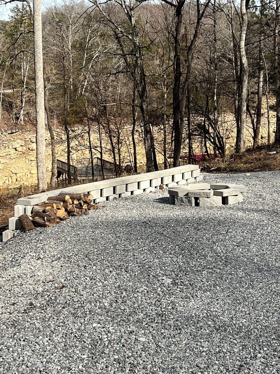 fire pit with plenty of play space around it directly across from the property