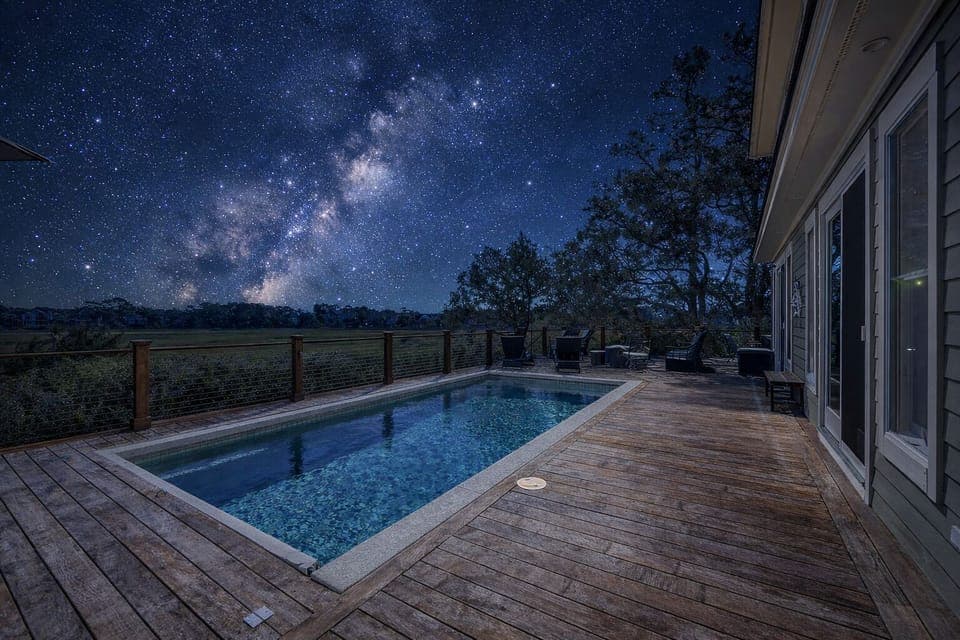 Starry-night swim. Poolside under the Milky Way.