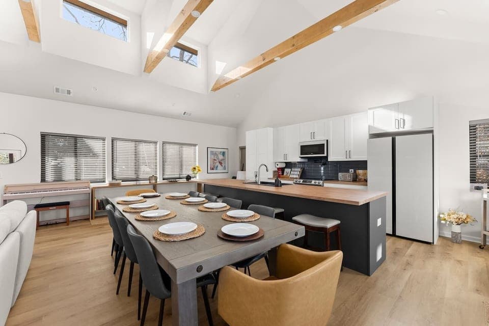 Spacious dining table with extensions available to host up to 14 guests—perfect for large gatherings.
