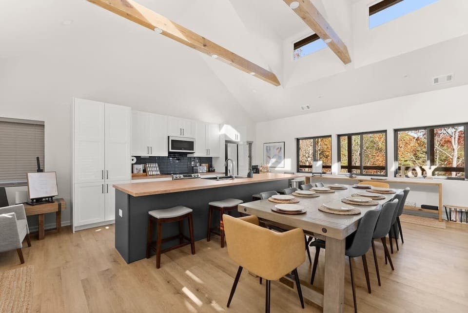Spacious dining table with extensions available to host up to 14 guests