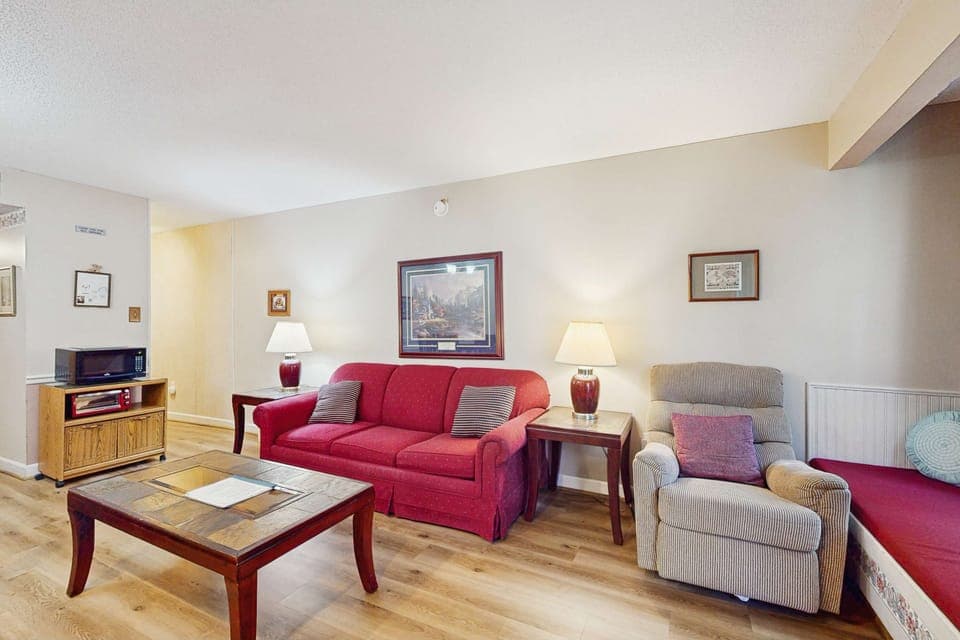 Living room retreat awaits. And, enjoy sleek furnishings and cheerful decor for unforgettable gatherings!