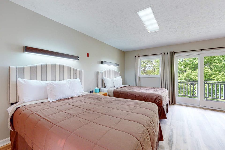 Spacious retreat with vibrant views, two plush beds, and bright natural light!