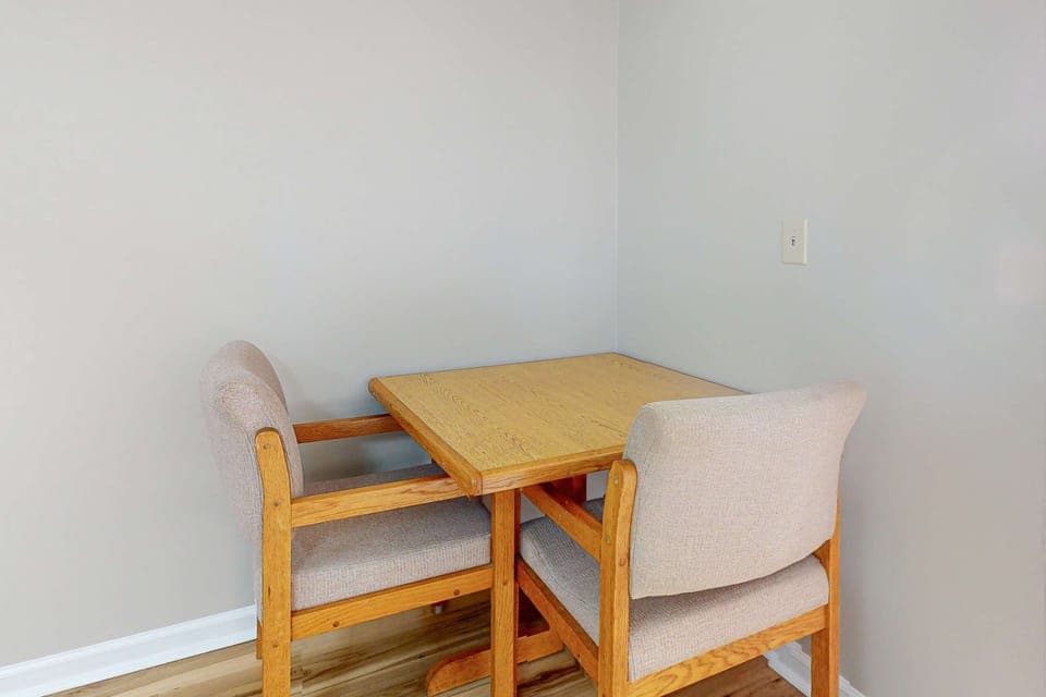 Cozy dining nook for two, eat, work, or play cards. Ideal for couples’ getaway, remote work, extended stay convenience, and relaxing lodging near local attractions.