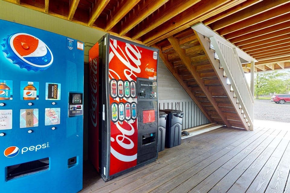 On-site vending area with Pepsi/Coke drink machines. Quick snacks and beverages just steps from your suite. Convenient resort amenity for late-night cravings, family stays, golf trips, and extended bookings.