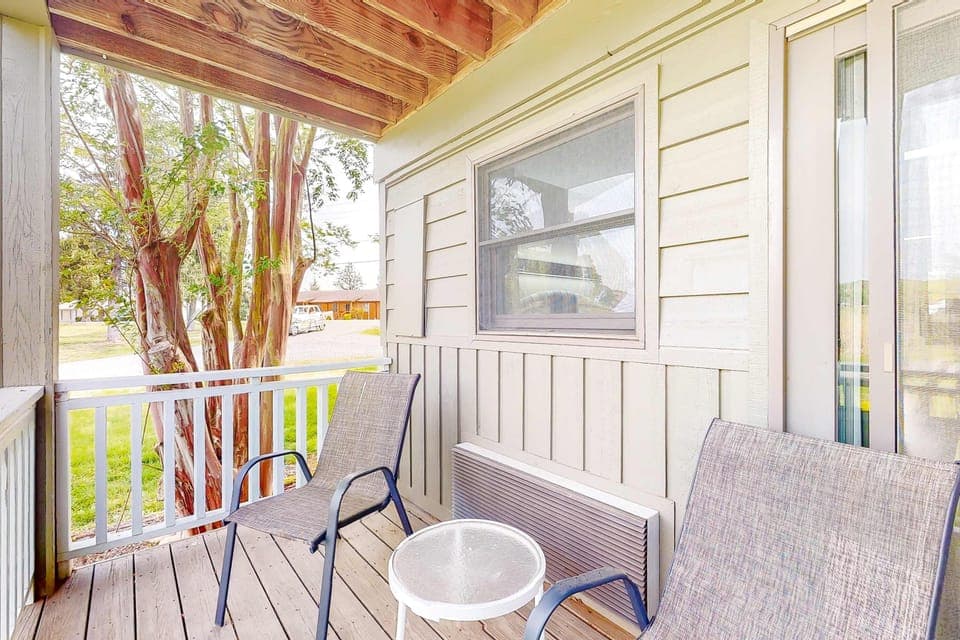 Private covered porch with seating. Relax outdoors with fresh air and peaceful views. Great for morning coffee, couples, and weekend getaways. With, outdoor space, patio, balcony, 