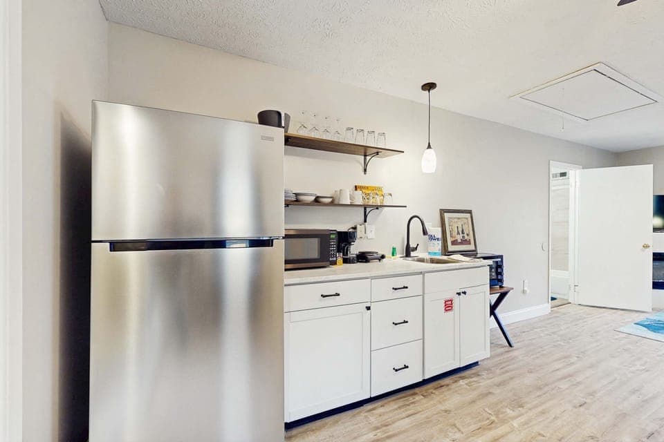 Sleek stainless steel appliances and stylish decor await your culinary adventures!