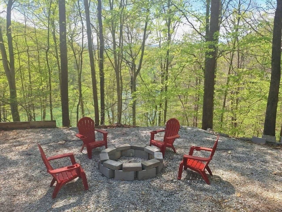 Outdoor fire pit retreat awaits. And, gather around the fire and take in stunning forest views!