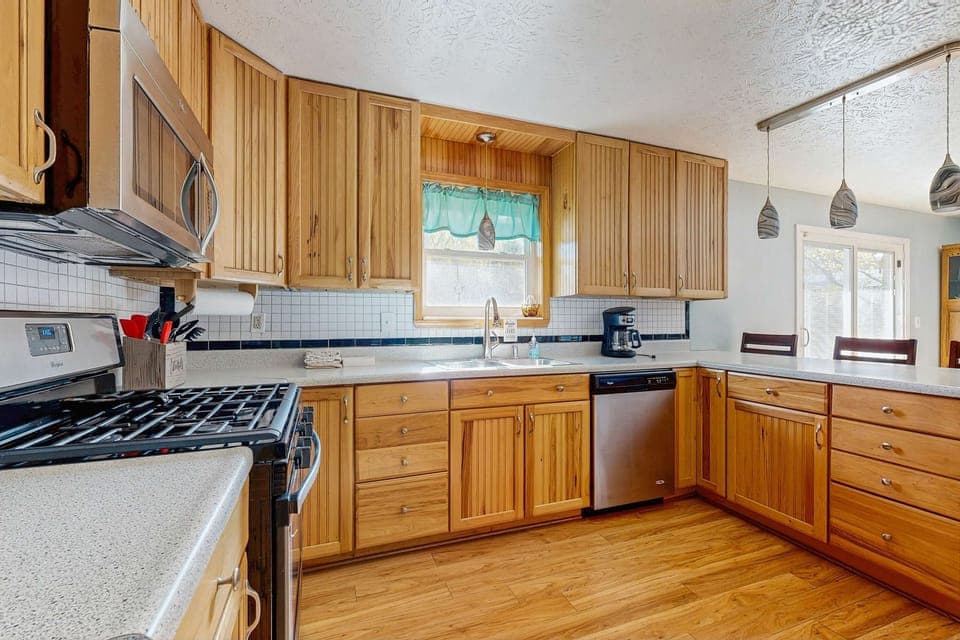 Cook up a storm in this bright, airy kitchen with modern appliances and cheerful decor!
