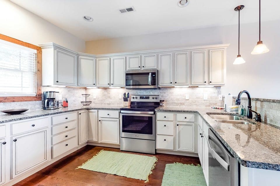 Enjoy culinary adventures in this modern kitchen with stunning granite counters!