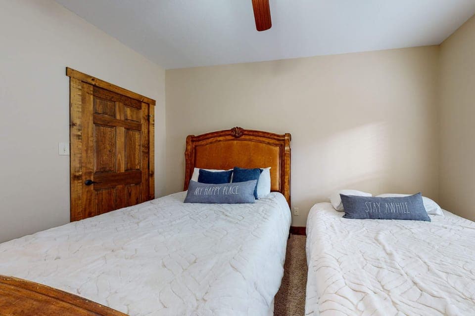 Fun-filled adventures await in this charming bunk room with rustic wood accents!