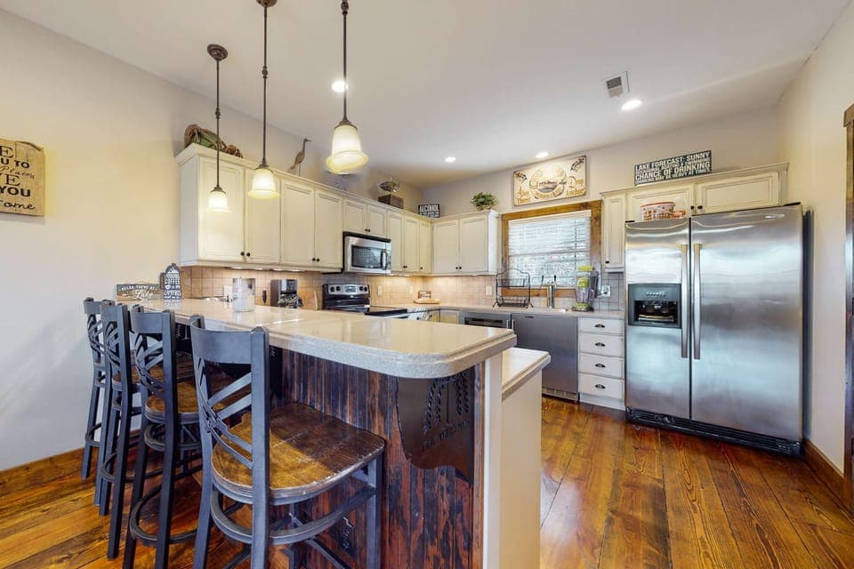 Stylish bar seating and modern appliances make meal prep a delight!