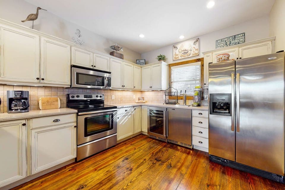 Spacious kitchen awaits. And, cook up a storm with modern appliances and warm wood accents!