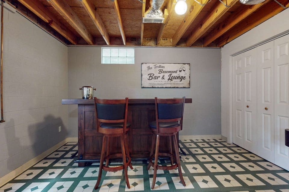 Basement Bar & Lounge awaits! Sip and unwind in your private hangout, complete with classic charm!