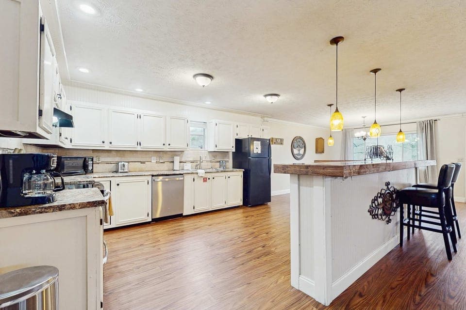 Inviting kitchen space with modern appliances and bar seating for delightful meals!