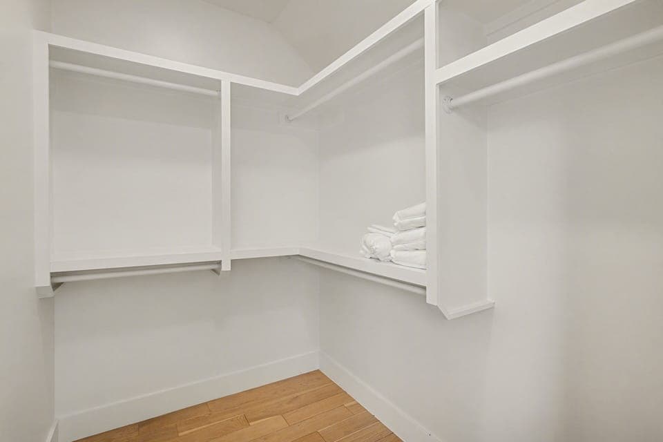 3rd Floor: 2nd Bedroom featuring a Queen bed, large walk-in closet, and an en-suite bathroom.