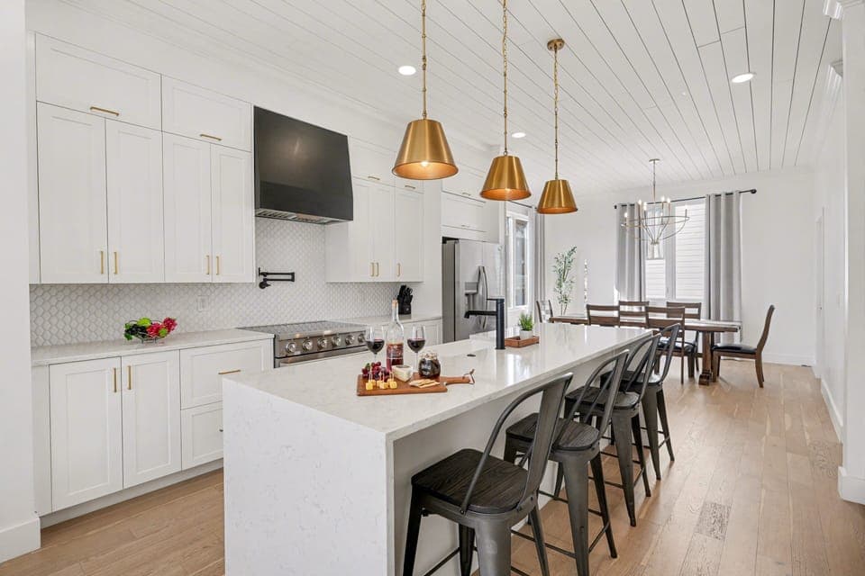 2nd Floor: Fully equipped kitchen with stainless steel appliances, a kitchen island with seating for 4 guests, wine cooler, and amble counter space.