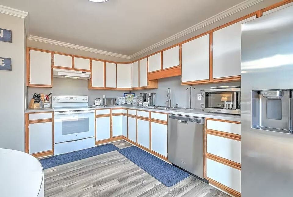 Sleek and functional kitchen with oven and all cooking necessities.