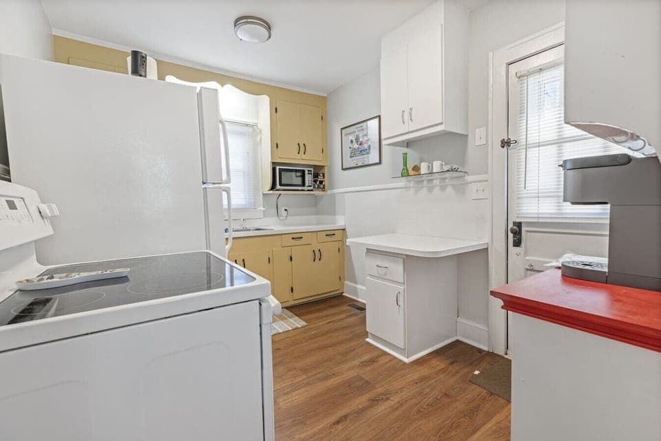 Fully equipped kitchen with laundry area for added convenience during your stay.
