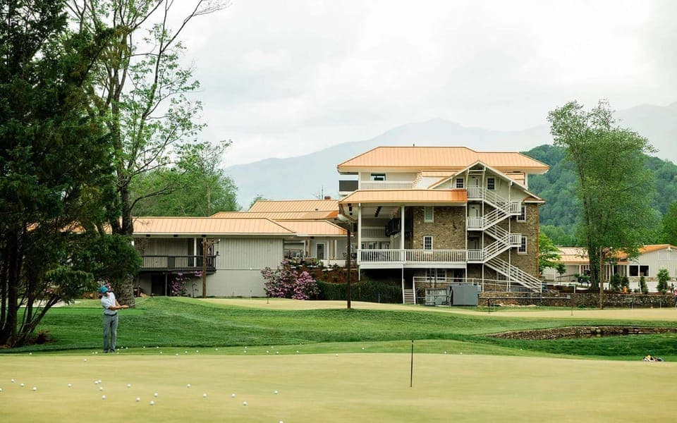 Practice green with scattered golf balls