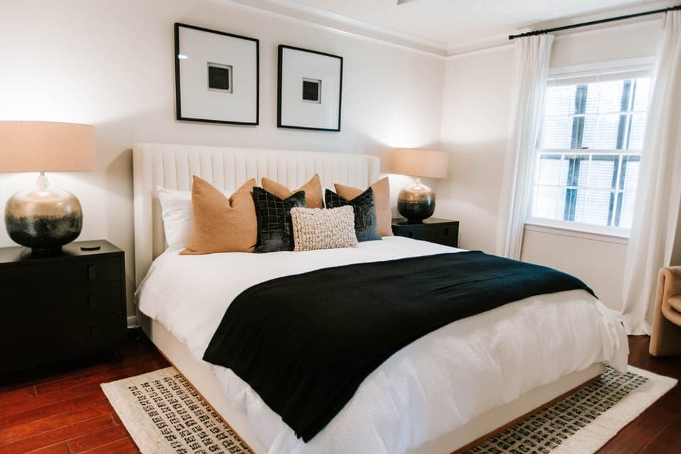 Dreamy king suite with luxe bedding, warm lighting, and modern comfort. Includes an ensuite bathroom.