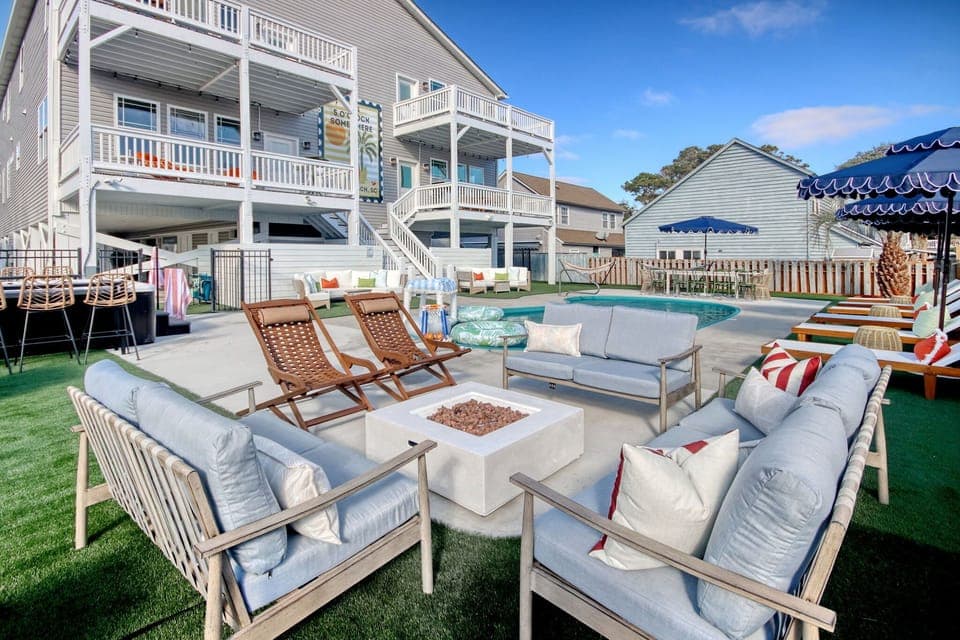 Gather around the glowing firepit as the ocean breeze drifts in, sharing stories, laughs, and late-night drinks under a sky full of stars. Cozy seating invites everyone to unwind together and savor those unforgettable Myrtle Beach evenings.