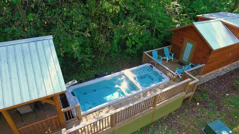 Bryce and it's neighboring cabin, River share a swim spa and hot tub.