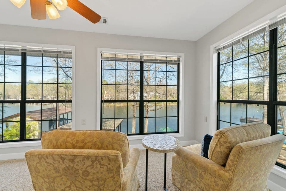 Bright and spacious sunroom with views of the lake