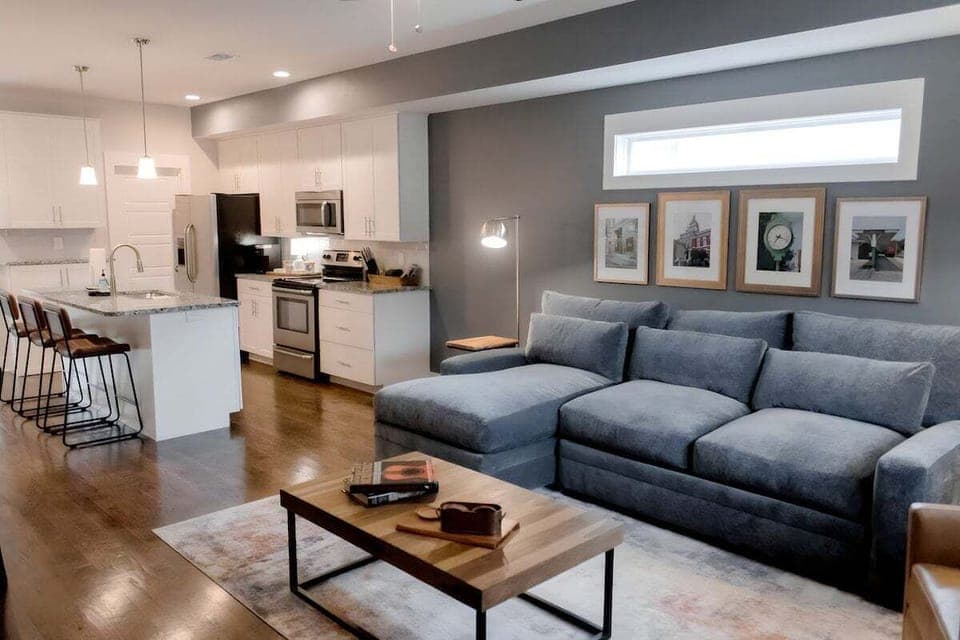 Downstairs open concept spacious well stocked kitchen, comfy living room, dining room and 1/2 bath.