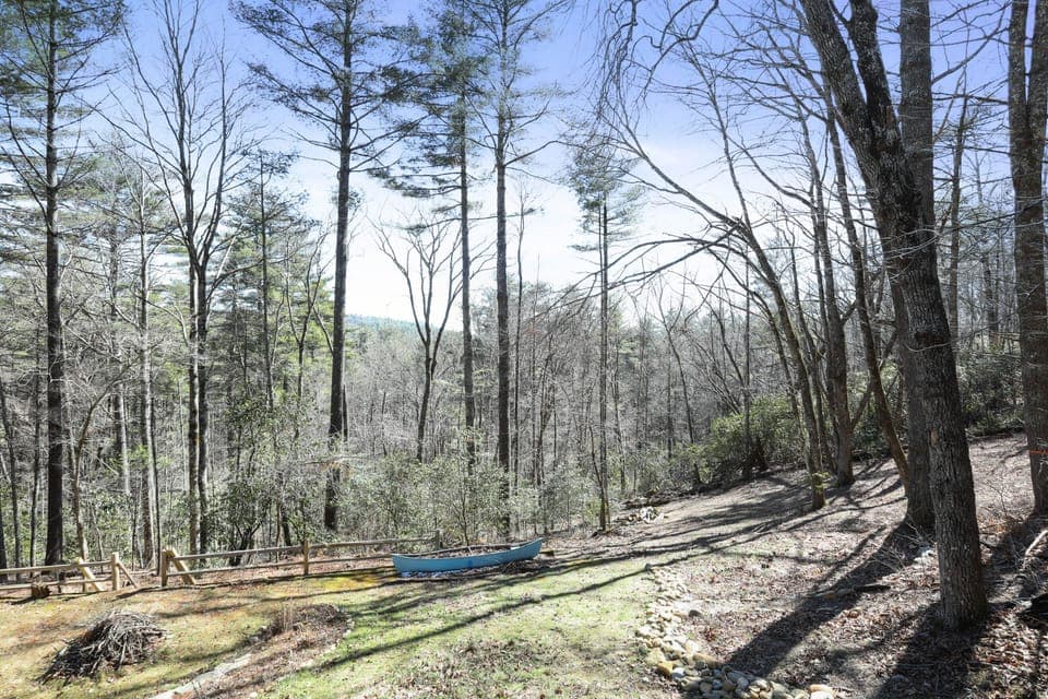 This open stretch of mountain hillside is pure possibility. Morning sun filters through the trees, birds call from the canopy, and the quiet wraps around you like a favorite blanket. Whether you're sipping coffee at the edge or stargazing after dark, this is your place to simply *be*.