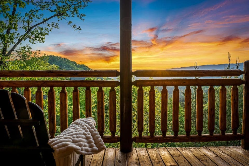 Cozy porch seating with breathtaking mountain views—perfect for morning coffee or sunset relaxation.