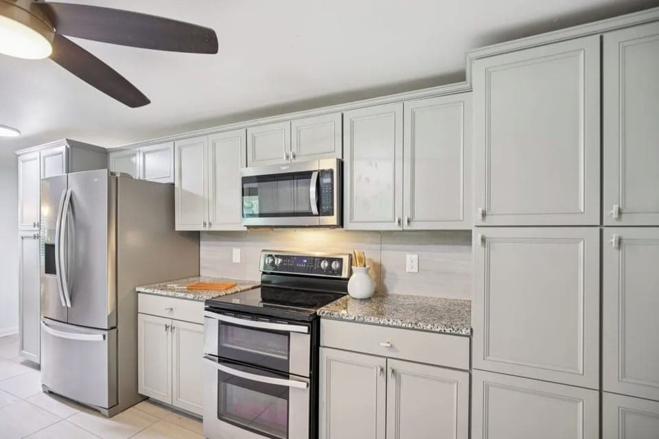 Kitchen with double oven and microwave
