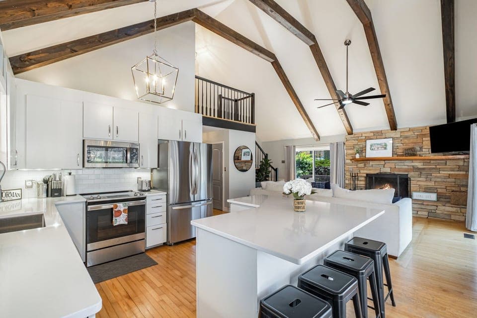 Fully stocked kitchen with island seating for 4.