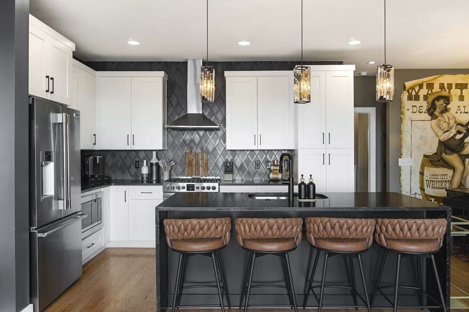 Open floor plan from the kitchen to living room, equipped with comfortable furnishings and all the kitchen essentials you would need. Enjoy the bar cart and additional seating for 4 at the kitchen island.