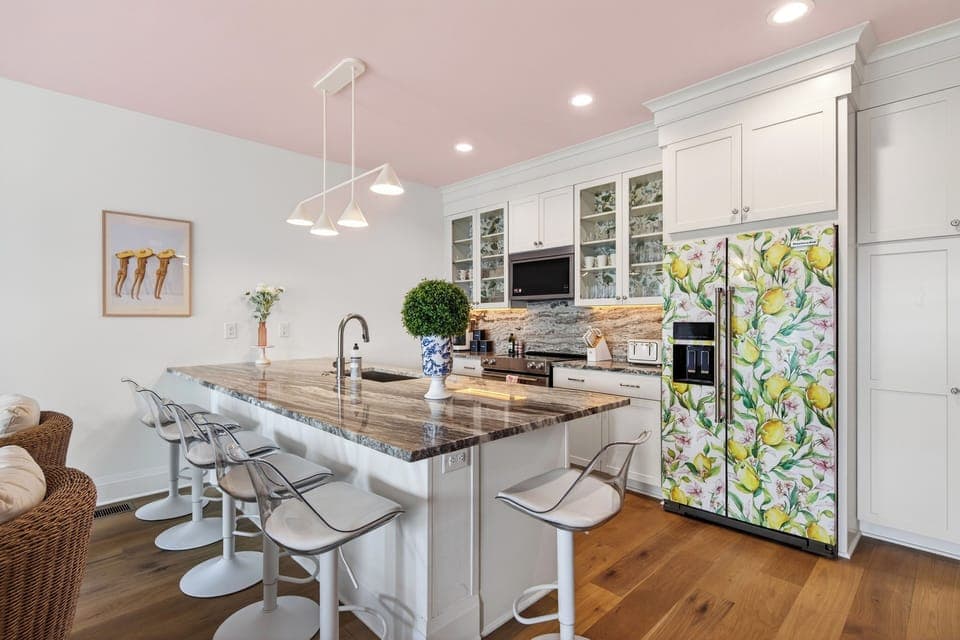 Fully equipped kitchen with island seating and standout design details. (Girls Night Out)