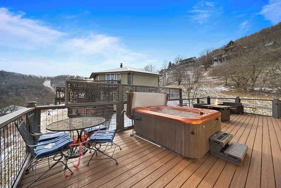 Large Decked Area with Hot Tub, Fire Table, and Bistro-Style Iron Table