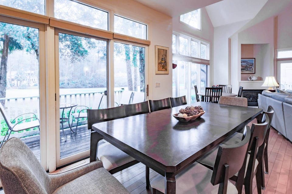 The large dining table seats 9, the smaller dining table seats 4 and there is an additional dining table outside.