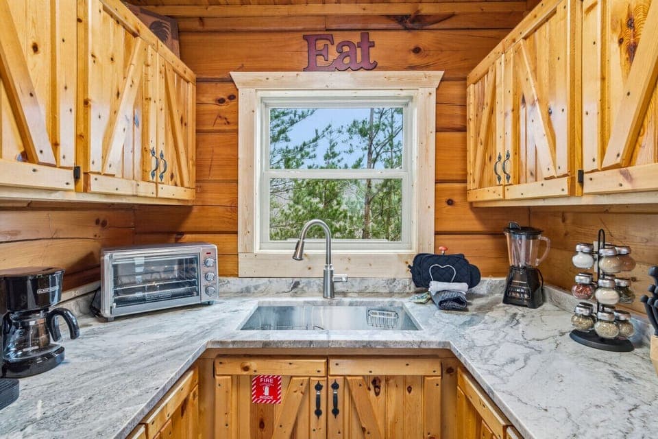 Kitchen | Stainless Appliances, Wood Cabinets & Forest Views