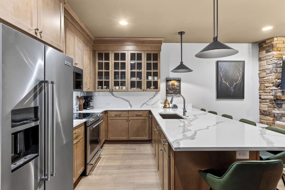 Fully equipped kitchen with a roomy island—grab a seat at the breakfast bar and keep the conversation going.