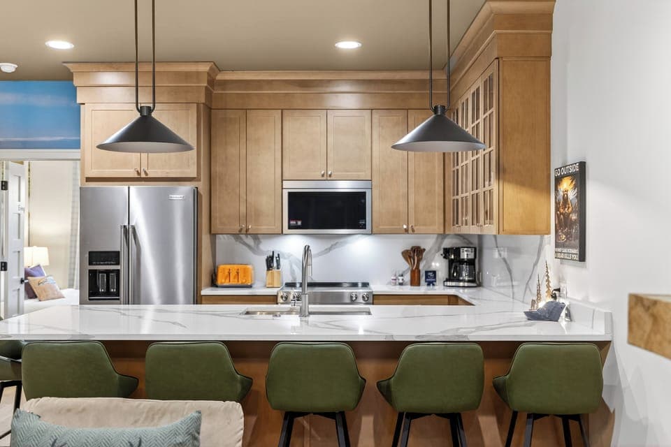 Fully equipped kitchen with a roomy island—grab a seat at the breakfast bar and keep the conversation going.