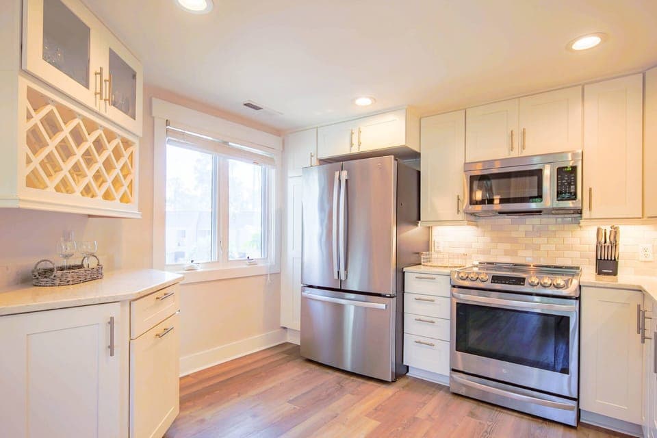 There is also a refrigerator and wine storage area within the kitchen.