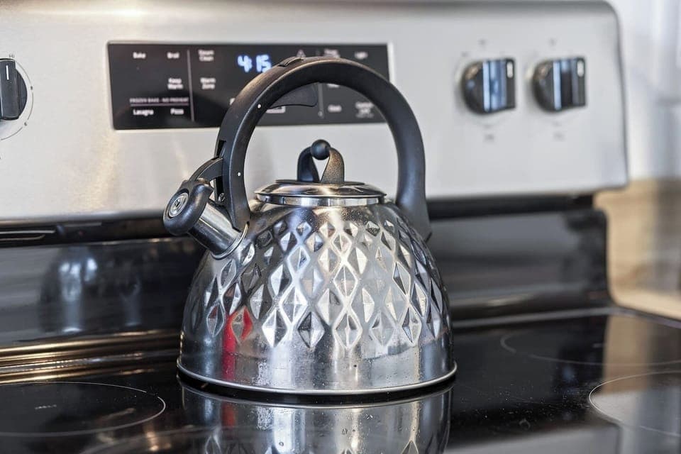 Clean and modern kitchen with stainless steel appliances.