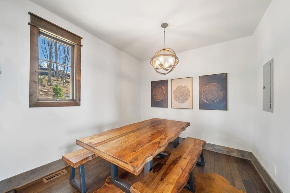 Dining Area Adjacent to the Kitchen with Raw Edge Wood Dining Table