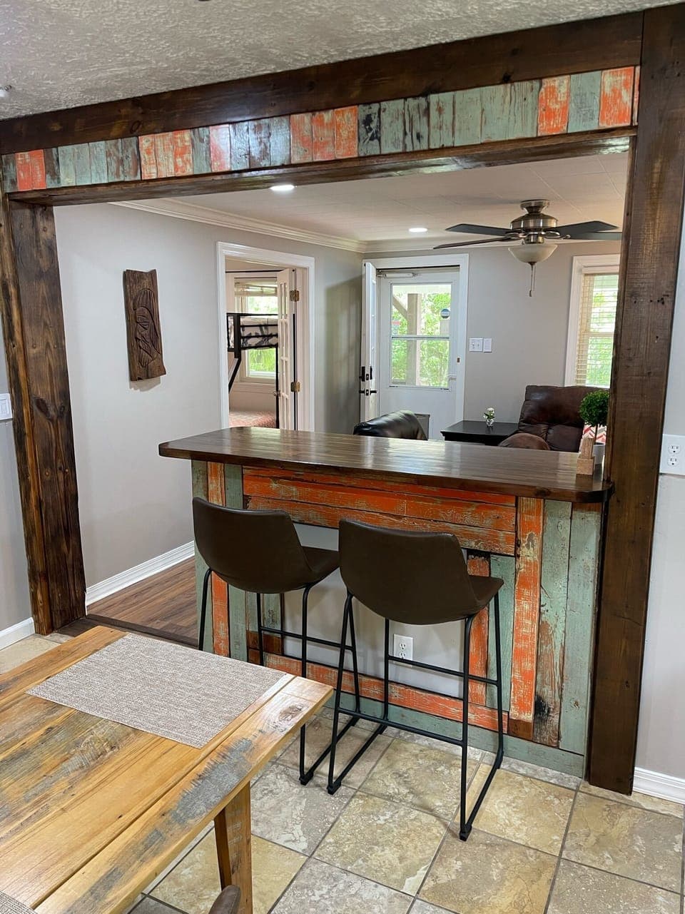 Rustic bar seating area with workspace in Brevard NC furnished home