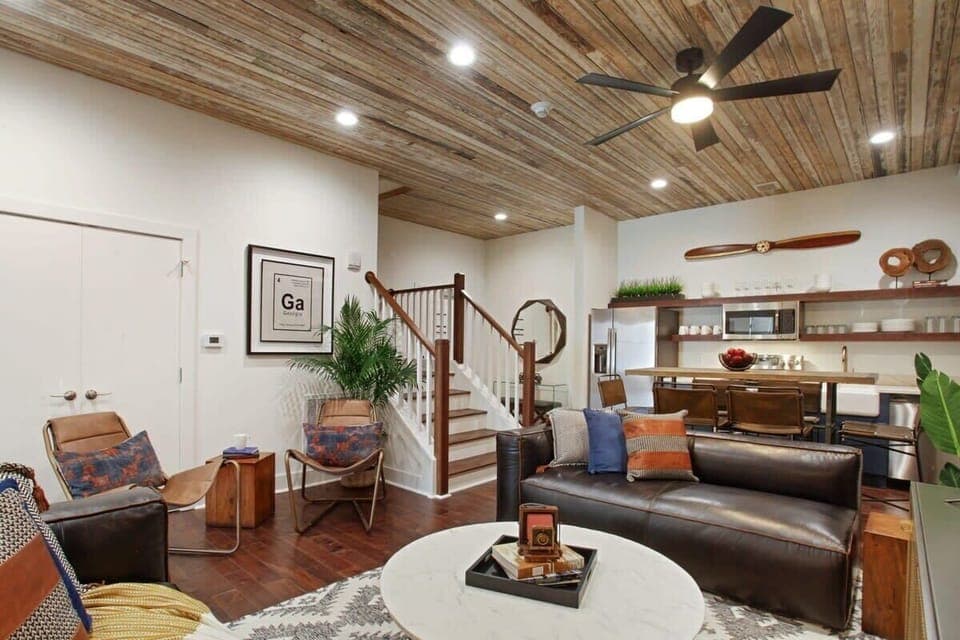Unit A Living Room | Comfortable Seating Area and TV | First Floor of Third Floor Unit