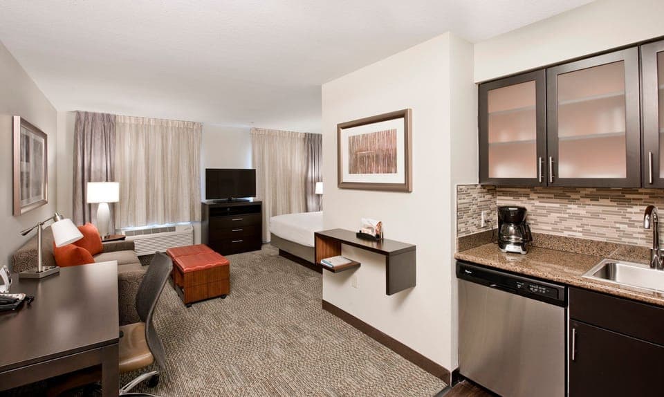 Queen studio suite layout features a queen bed and a pull-out sofa.